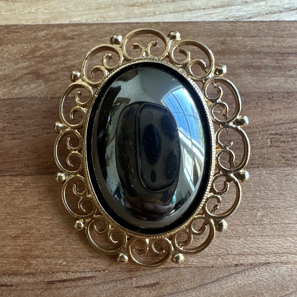 Vintage Brooch Pin 1.5 Inch Ornate Filigree Oval Hematite Cab Ornate Gold Plated